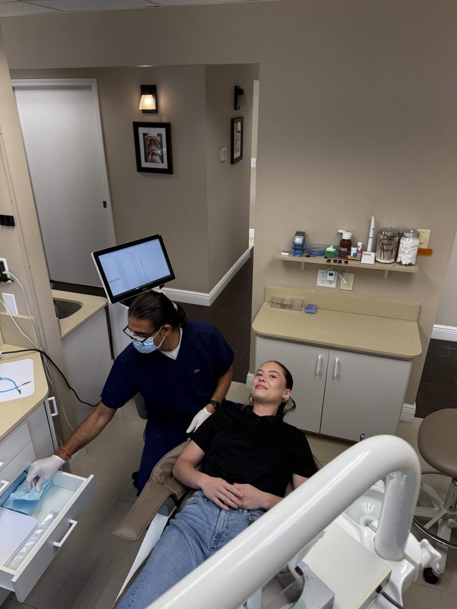 Dr. Patel and the team providing care at The Smile Gallery in Melbourne, FL